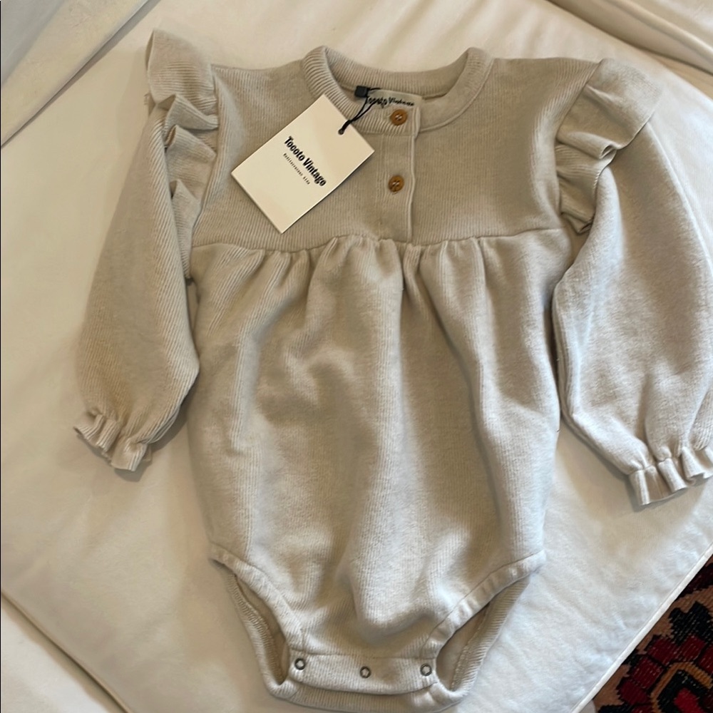 Cream Baby Onesie with Ruffle Sleeves